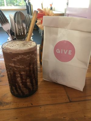 Chocolate mylkshake and banana choc chip muffin in the bag  at Give Cafe in Canggu