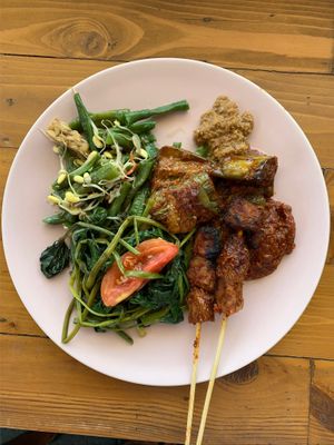 Mixed custom plate with satay, grilled veggies and jackfruit curry   at Give Cafe in Canggu