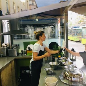 Chef Andreea happily serving a super-duper FALAFEL WRAP....come get yours today! 😍 at Garbanzo - Falafel & Hummus Bar in Vienna