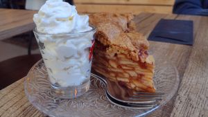 Apple cake with whipped cream (and two forks) at Het Slachthuis in Leiden