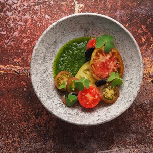 tomatoes from local farmers, pesto sauce made from wild growing herbs, "pomorka" salt.  at Barclay Restaurant in St Petersburg