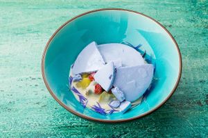 Cream of jasmine flowers, malt biscuit, caramelized rhubarb, fresh wild strawberries and blue tea merengue. at Barclay Restaurant in St Petersburg