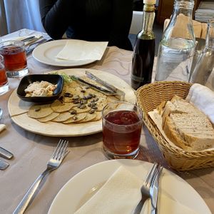 Vegan plate with vegan ham and spreads + grape juice  at Güjžina - Green One Bistro in Ljubljana