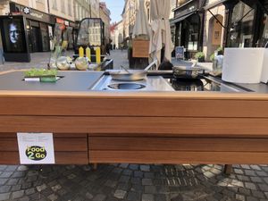 outside kitchen where dishes are prepared in front of you at Güjžina - Green One Bistro in Ljubljana