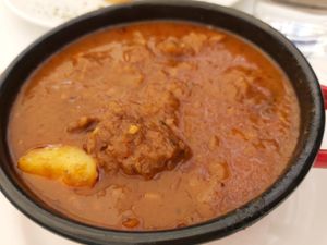 Vegan bograč soup with seitan, potato and other vegetables at Güjžina - Green One Bistro in Ljubljana