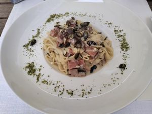 Tagliatelles with ham and roasted pumpkin seeds at Güjžina - Green One Bistro in Ljubljana