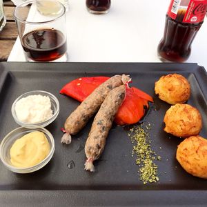 Vegan sausage with grilled pepper, horseraddish, mustard and potatoes. at Güjžina - Green One Bistro in Ljubljana