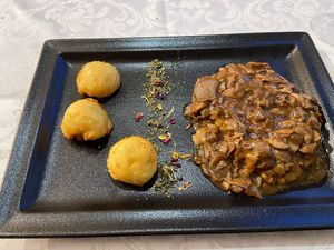 Steak with mushroom sauce at Güjžina - Green One Bistro in Ljubljana