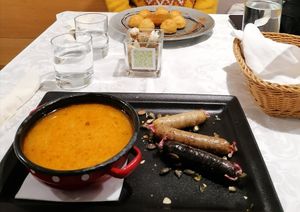 24,7€ for both plates, the Tris of sausages and the potatoes at Güjžina - Green One Bistro in Ljubljana