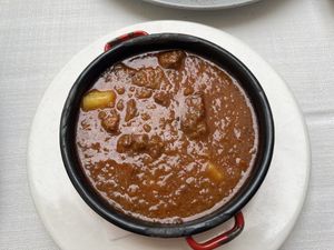 traditional soup (vegan meat and potatoes)  at Güjžina - Green One Bistro in Ljubljana