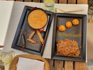 Dark seitan steak with mushroom sauce and vegan sausages at Güjžina - Green One Bistro in Ljubljana