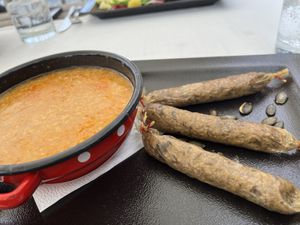 Can’t remember name of dish. Vegan sausage and soup   at Güjžina - Green One Bistro in Ljubljana