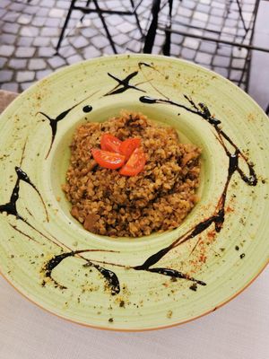 Buckwheat with seitan and porcini at Güjžina - Green One Bistro in Ljubljana