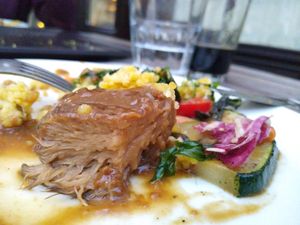 Close up of the lion mane mushroom steak mignon cut through at Güjžina - Green One Bistro in Ljubljana