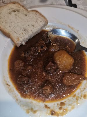 Traditional Slovenian soup with soft bread at Güjžina - Green One Bistro in Ljubljana