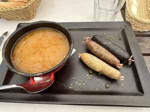 I forget the name of the dish, but it was described as three sausages with turnip-something!  at Güjžina - Green One Bistro in Ljubljana