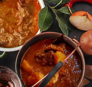 Vegan "bograč" with wheat "meat" with spices, soy cubes, potatoes, onions and garlic. at Güjžina - Green One Bistro in Ljubljana