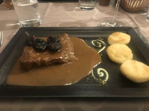Dark vegan steak with plum sauce (comes with potato side) at Güjžina - Green One Bistro in Ljubljana