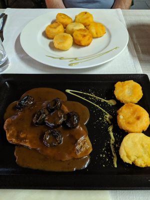 Vegan seitan steak with plum sauce and potato dumplings at Güjžina - Green One Bistro in Ljubljana