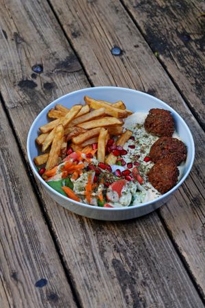 Falafel plate
creamy hummus/baba ganoush, 3 falafel balls, salad, sprouts, various pickled veggies, herb tahini, barberries, za'atar at Paralela in Prague