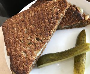 Grilled Cheese
Vegan Havarti, seedy bread. With pickles. 
Yummy. Will pair nicely with upcoming soups!  at Sweet Pea Cafe & Playhouse in Edmonton