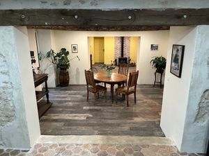 Dining room and living in room in Bella's Cottage. at La Grange DesRochers in Paley