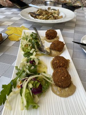 Walnut balls and sautéed mushrooms at Valia Calda in Kalampaka