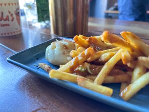 Chips with penang curry sauce at Yulli's Brews in Alexandria