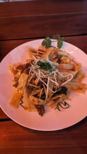 Pad See Ew w/crispy tofu, green beans, asian herbs, beansprouts $17.00 at Yulli's Brews in Alexandria