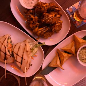 Vietnamese gyro, KFC cauliflower, Skordilia Dumplings  at Yulli's Brews in Alexandria