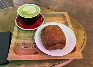 Vegan chocolate croissant and matcha latte with oat milk at Croissant Croissant in Montreal