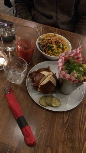 Boujee mac, pulled pork sandwich with side poutine, with César Chávez and John Lemon cocktails at Renegade Kitchen & Craft Bar in Kelowna