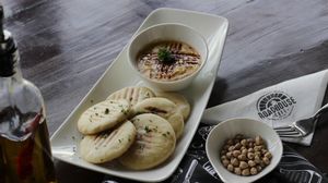 Roadhouse Cafe Vegan Chipotle Chili Hummus at Roadhouse Cafe & Nom Yum Delivery in New Delhi