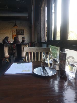 Table at Roadhouse Cafe & Nom Yum Delivery in New Delhi