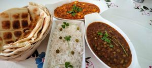 Garlic naan-Methi matar-coconut corn masala  at Milan's Restaurant in Moshi