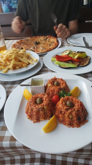 Risotto, grilled vegetables, vegan pizza and french fries at Cafe Del Mare in Kotor