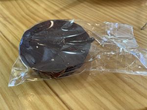 Alfajor (Latin American chocolate-coated almond-based cookie filled with vegan dulce de leche)  at Papas Elvira in Granada