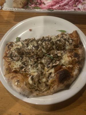Mushroom and onion pizza with follow your heart cheese   at Full Of Life Flatbread in Los Alamos