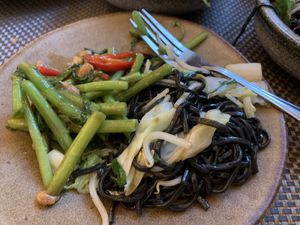 Morning glory stir fry and black noodles at Giggling Squid in Bath