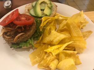 Homemade vegi-burger with plantain chips. at Lúcuma in Guadalajara