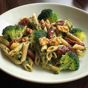 Vegan wholewheat pasta with basil pesto sauce, sun-dried tomatoes, broccoli and walnuts.  at 80 20 Health Bar & Kitchen in Bolton
