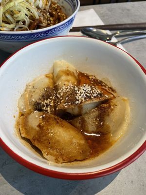 Potato-filled dumplings with spicy sesame sauce   at Cai Kitchen in Hamburg