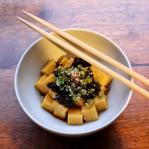 Polenta with fermented black soy beans at Cai Kitchen in Hamburg