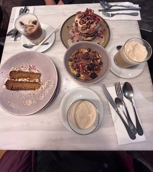 Carrot cake, pomegranate pancakes, pumpkin oatmeal, caramel latte and almond frappuccinos  at Comoba in Lisbon