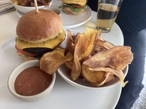 Vegan burger with side of crisps  at Comoba in Lisbon