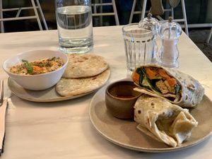 Hummus and Breakfast Burrito  at Comoba in Lisbon