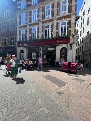 Exterior of the store with outside seating at Pret A Manger - Great Marlborough St in London