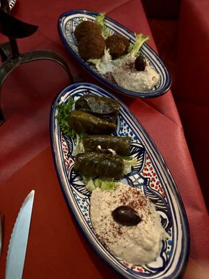 In alto falafel con hummus. Sotto dolmades: involtino di riso con foglia di vite.  at Frary's in Venice