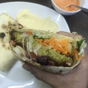 Vegan mega falafel with lots of veggies, hummus, fresh house made pita and tomato sauce! Soo so good and only 10 sols!  at Green Falafel in Cusco