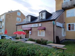 Exterior and outdoors seating area at Lilla Huset in Uppsala